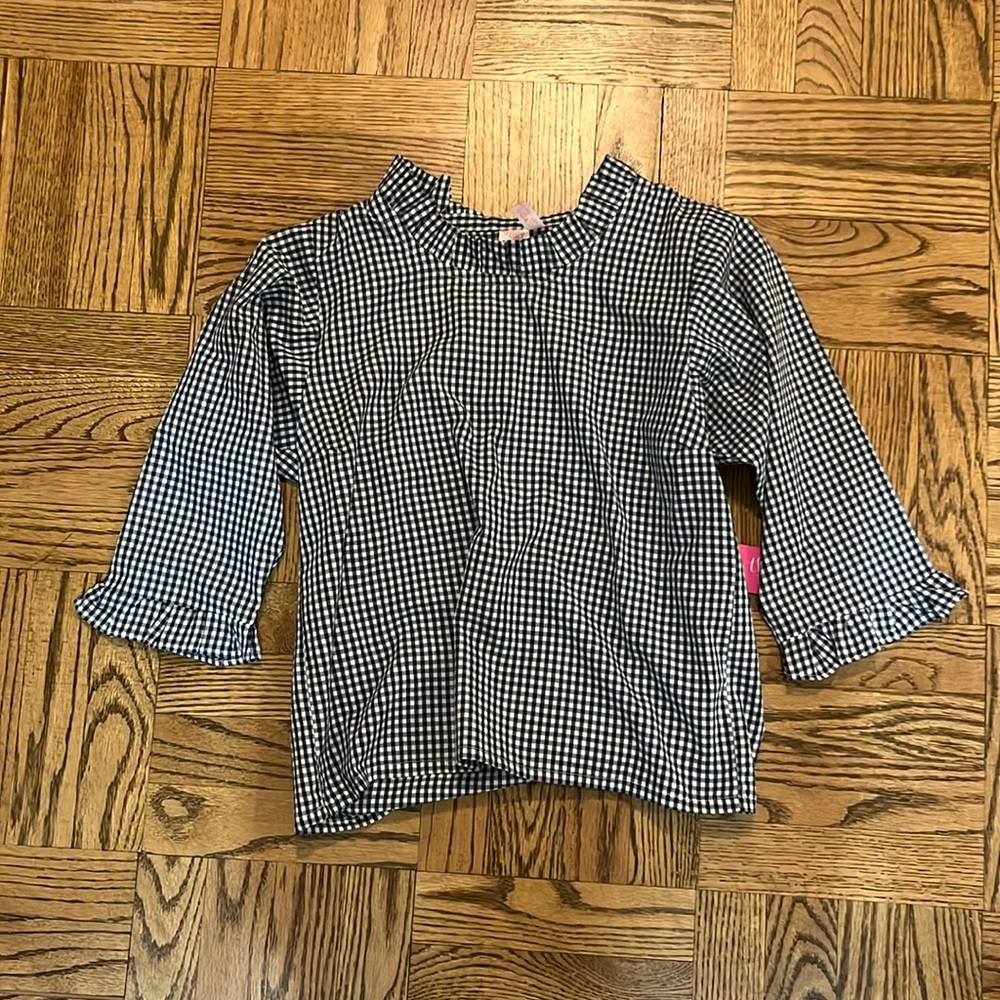Checkered blouse with high neck and ruffle sleeves